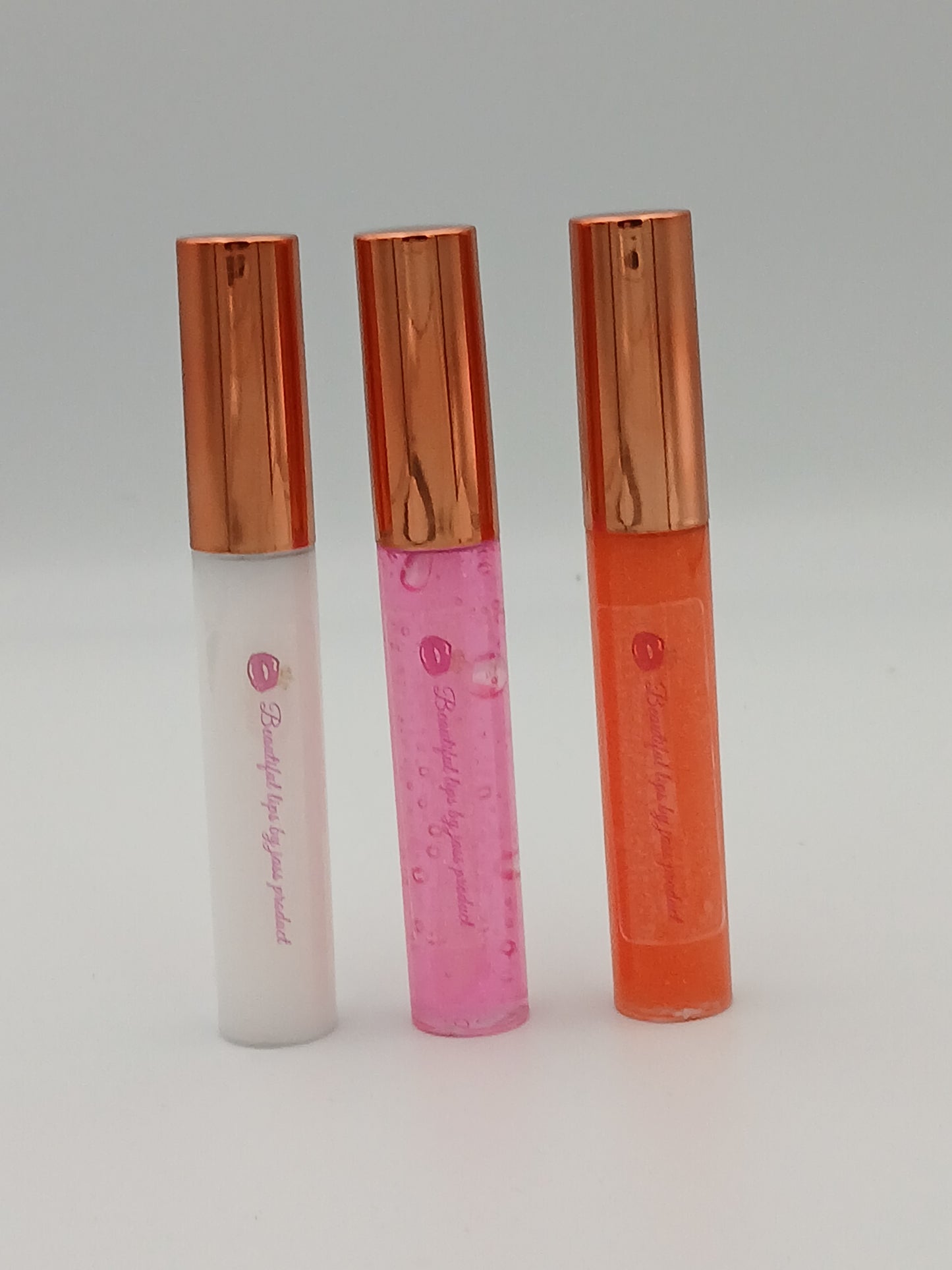 Lip gloss by jass production This lip gloss is made with jojoba oil, coconut oil, and mica powder to give your lips a natural shine and a soft, smooth feel. It hydrates, protects, and adds a radiant glow that makes you feel beautiful every day.