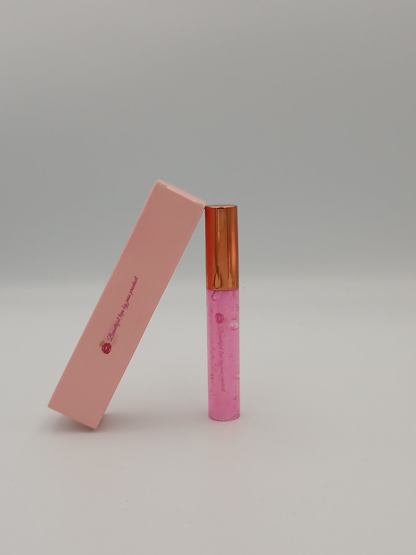 Lip gloss by jass production This lip gloss is made with jojoba oil, coconut oil, and mica powder to give your lips a natural shine and a soft, smooth feel. It hydrates, protects, and adds a radiant glow that makes you feel beautiful every day.