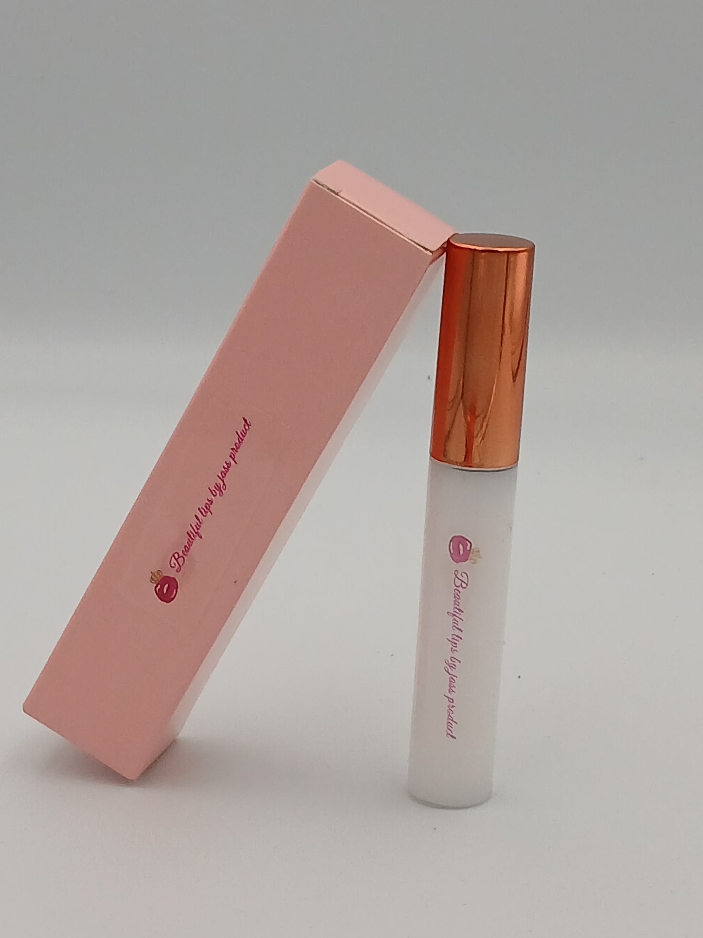 Lip gloss by jass production This lip gloss is made with jojoba oil, coconut oil, and mica powder to give your lips a natural shine and a soft, smooth feel. It hydrates, protects, and adds a radiant glow that makes you feel beautiful every day.