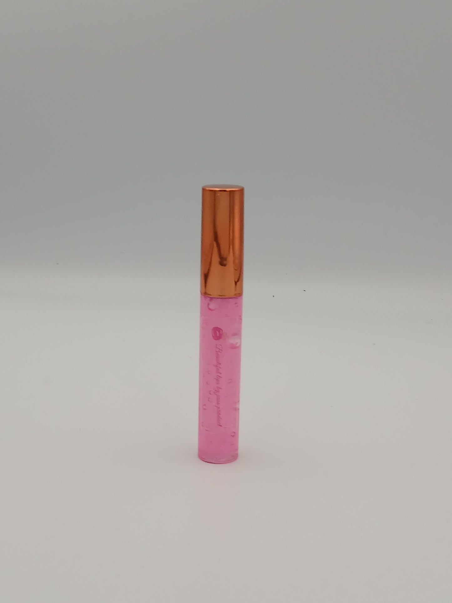 Lip gloss by jass production This lip gloss is made with jojoba oil, coconut oil, and mica powder to give your lips a natural shine and a soft, smooth feel. It hydrates, protects, and adds a radiant glow that makes you feel beautiful every day.