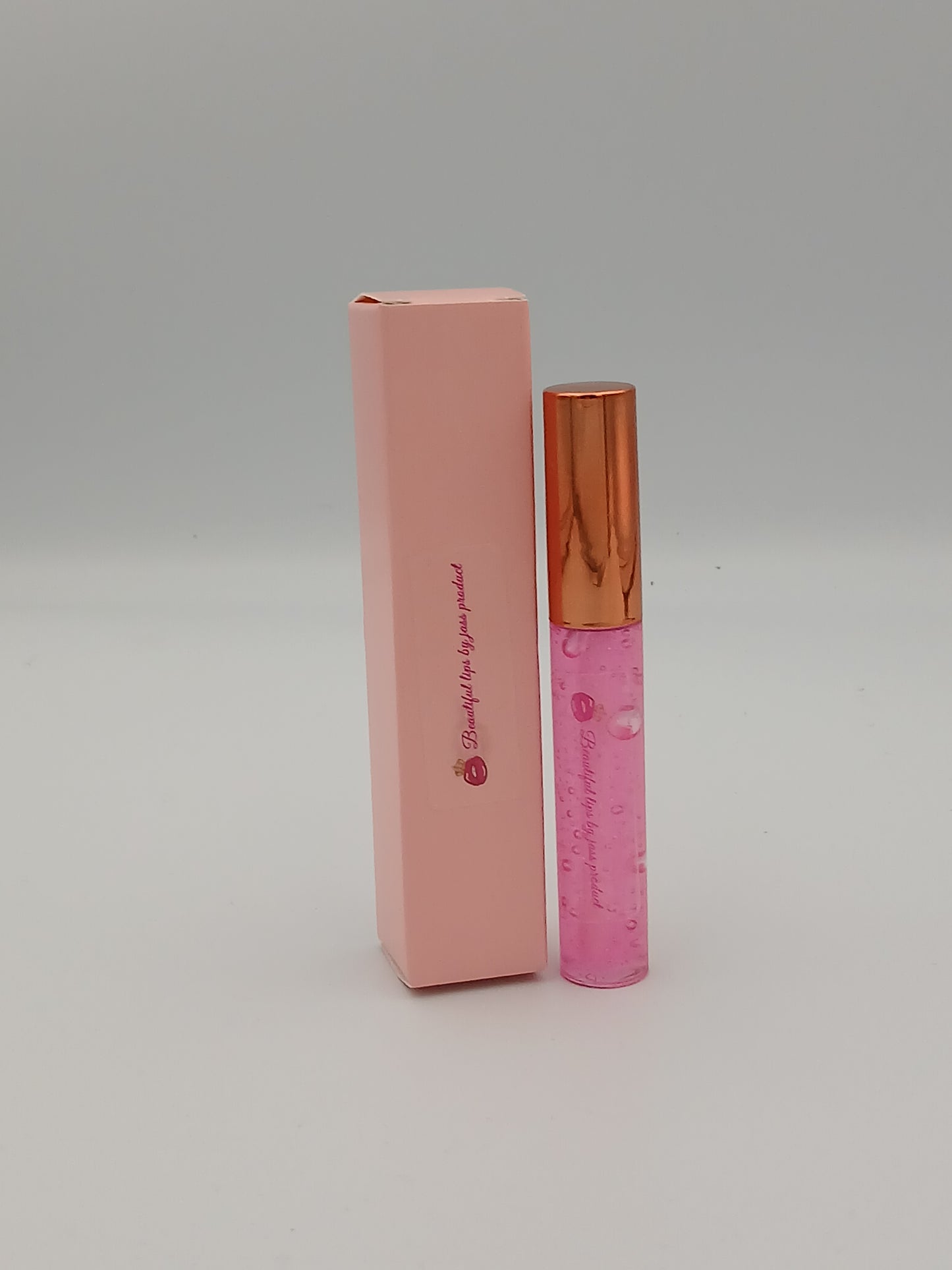 Lip gloss by jass production This lip gloss is made with jojoba oil, coconut oil, and mica powder to give your lips a natural shine and a soft, smooth feel. It hydrates, protects, and adds a radiant glow that makes you feel beautiful every day.